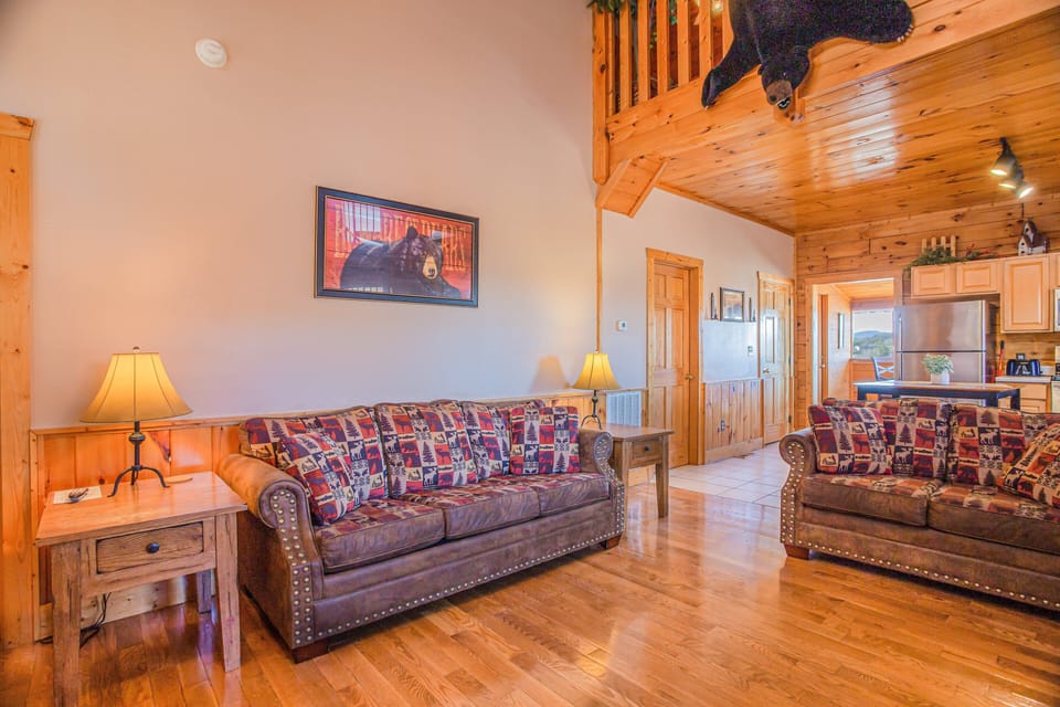 The main living room includes a pull-out sofa bed for more sleeping options.