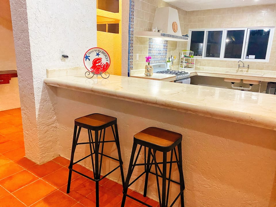 Open concept main level featuring kitchen, dining room and living room. 