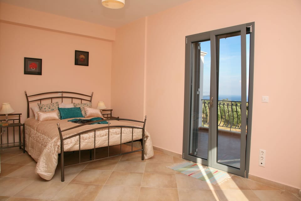 master bedroom with double-aspect balconies to take in the views