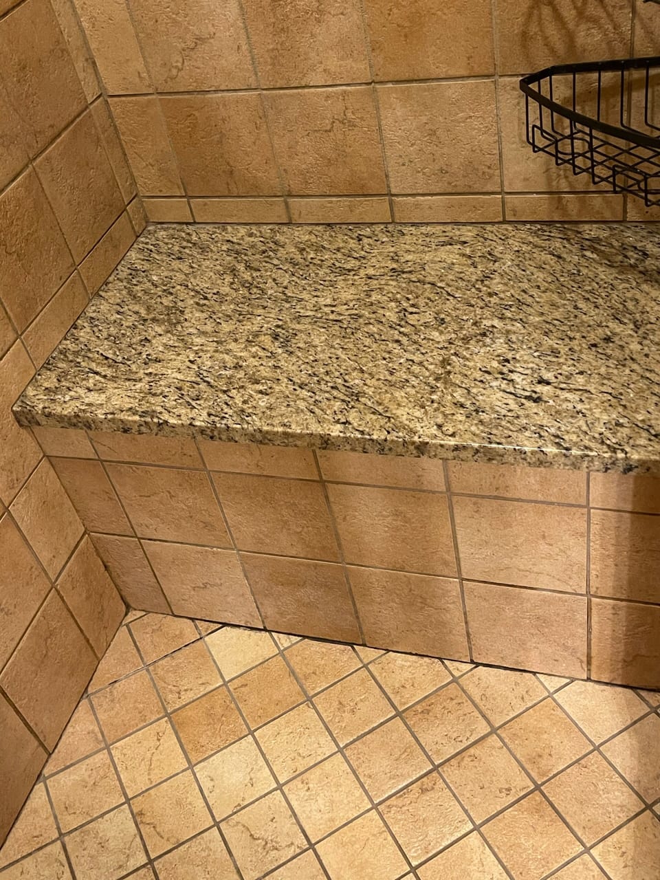Granite bench in walk in shower.