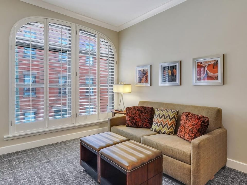 Cozy living area with plush seating and views from the window.