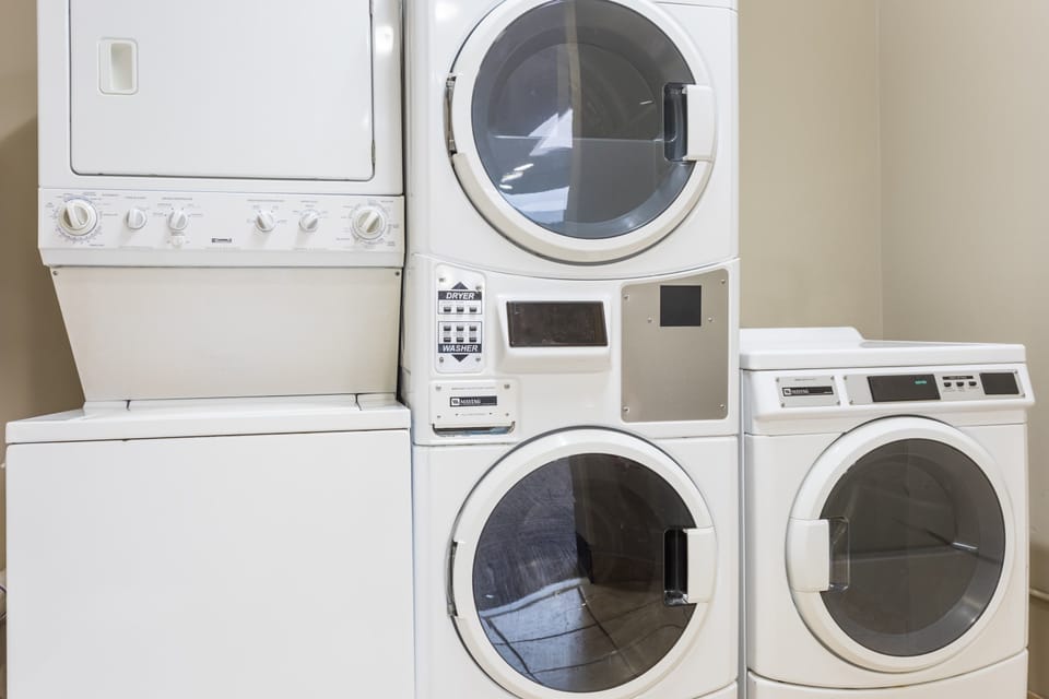 On-site self-service laundry room with modern washers and dryers.