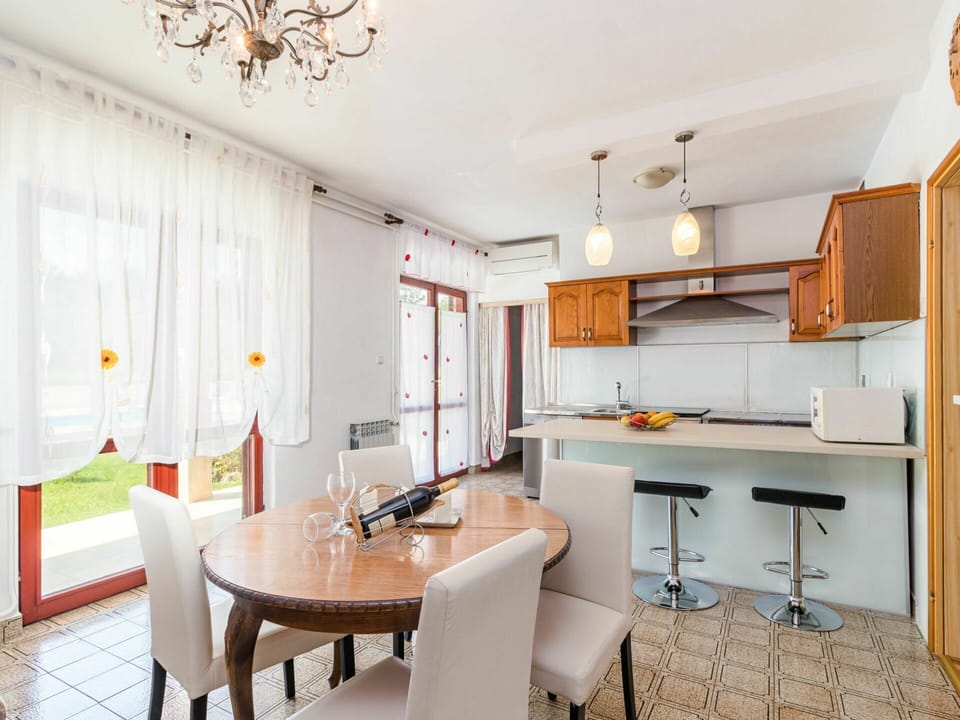 Furniture, Property, Table, Cabinetry, Chair, Orange, Interior Design, Kitchen, Lighting, Wood
