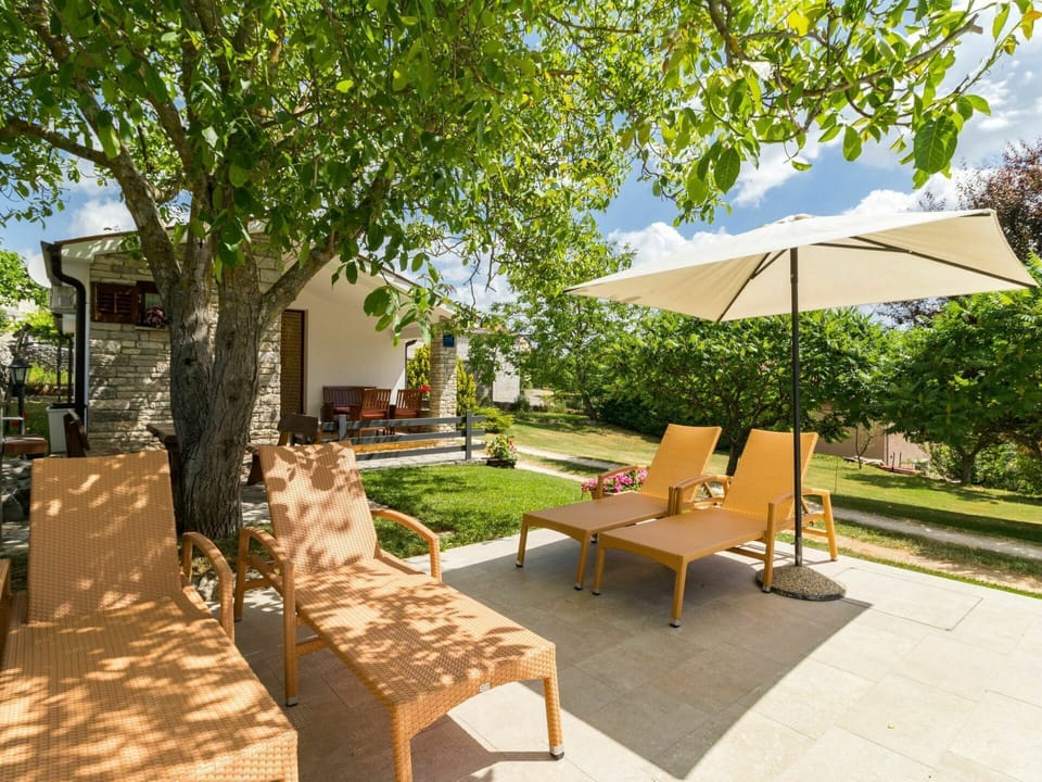 Plant, Property, Furniture, Building, Shade, Tree, Outdoor Furniture, Umbrella, Outdoor Table, Urban Design