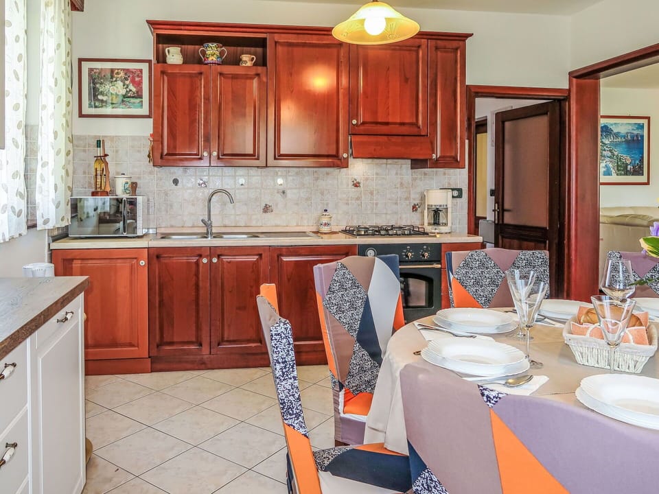 Furniture, Interior Design, Flooring, Floor, Room, Kitchen, Table, Cabinetry, Chair, Countertop