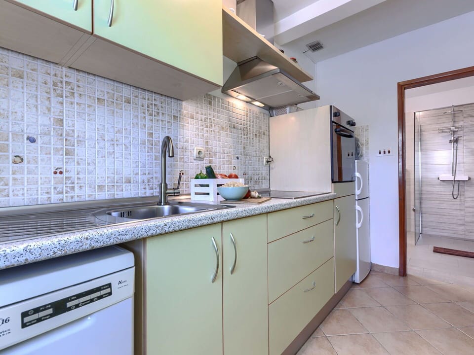 Kitchen, Countertop, Cabinetry, Kitchen Appliance, Major Appliance, Flooring, Kitchen Sink, Interior Design, Sink, Plumbing Fixture