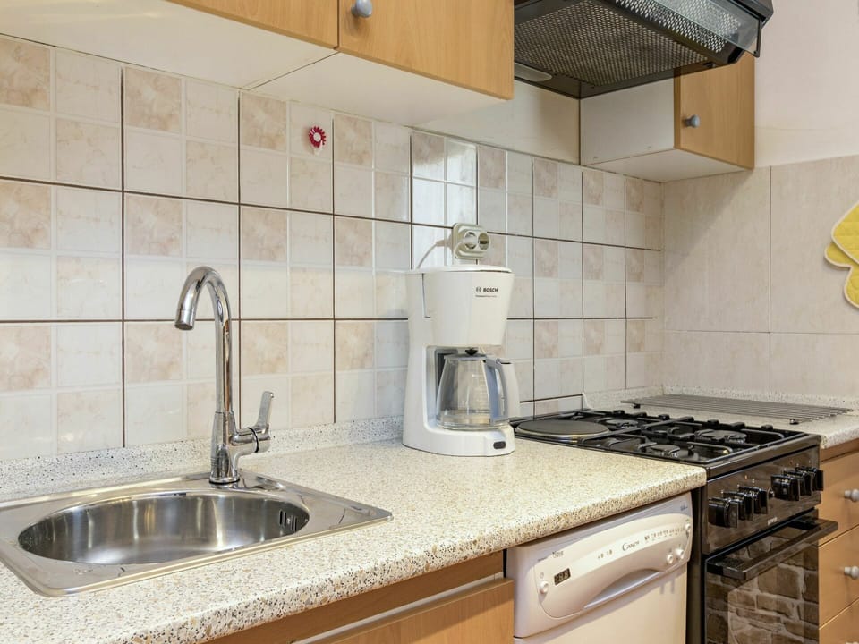 Countertop, Property, Tile, Room, Kitchen, Cabinetry, Sink, Interior Design, Furniture, Real Estate