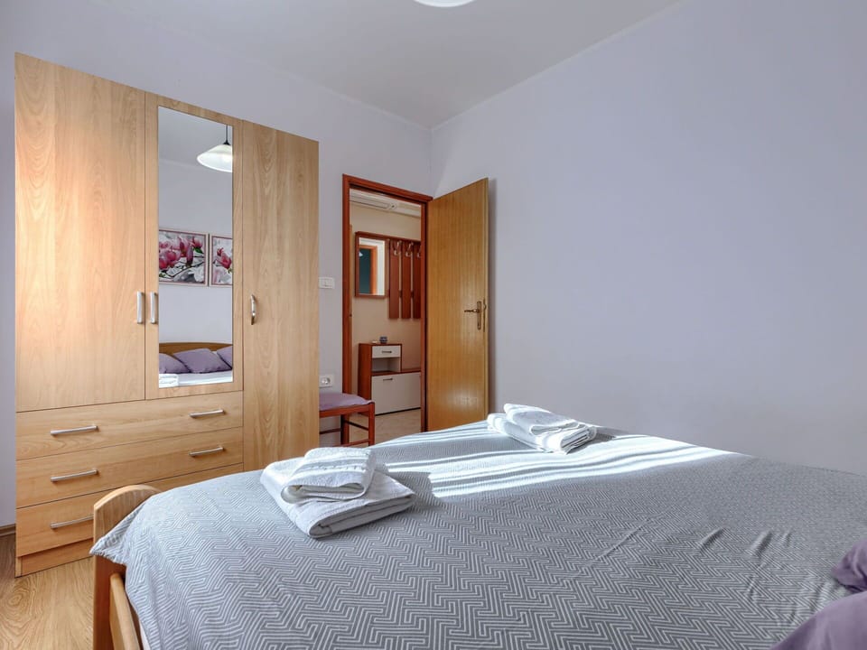 Furniture, Interior Design, Bed, Floor, Bedroom, Flooring, Wood, Room, Textile, Bed Sheet