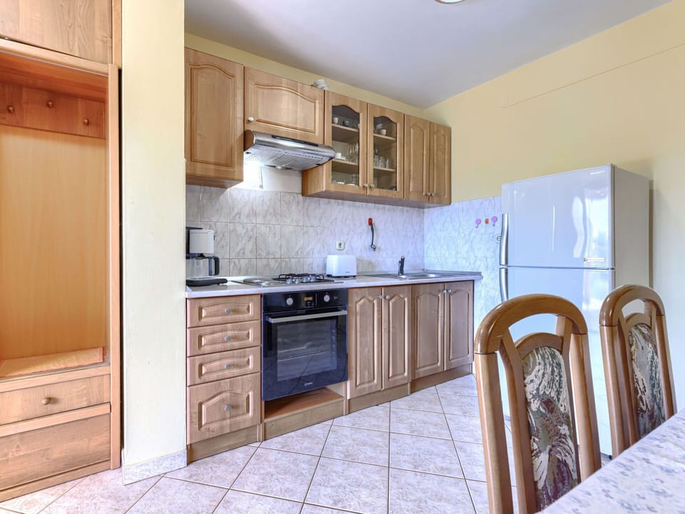 Flooring, Interior Design, Wood, Furniture, Floor, Cabinetry, Countertop, Kitchen, Room, Major Appliance