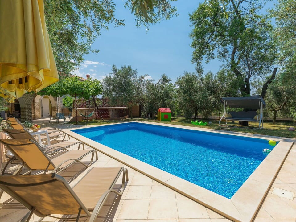 Water, Plant, Building, Swimming Pool, Sky, Chair, Azure, Tree, Shade, Outdoor Furniture