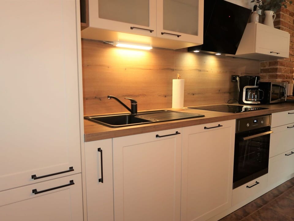 Cabinetry, Kitchen Sink, Countertop, Kitchen Appliance, Kitchen Stove, Kitchen, Wood, Home Appliance, Building, Stove