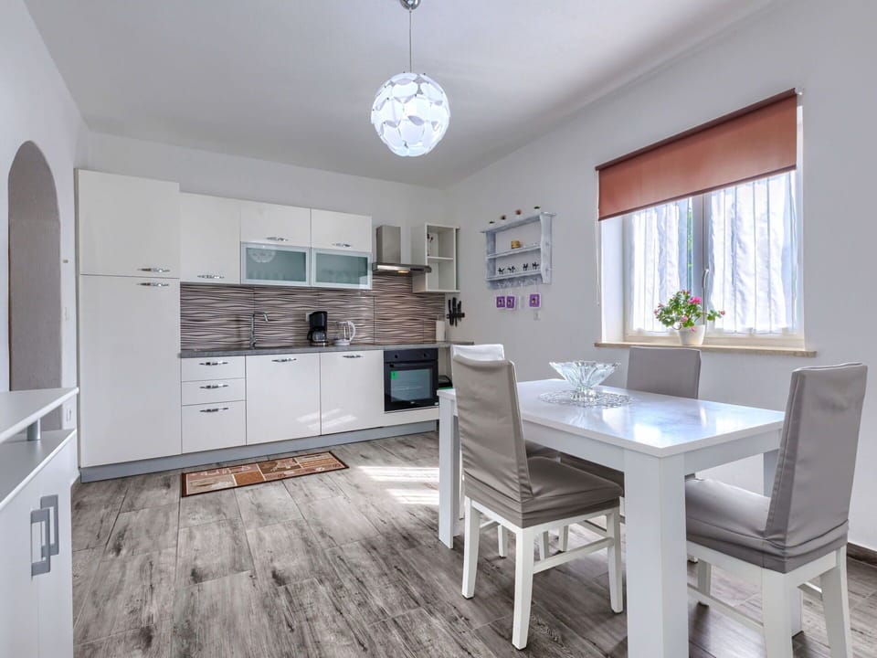 Furniture, Cabinetry, Table, Window, Countertop, Wood, Kitchen, Interior Design, Lighting
