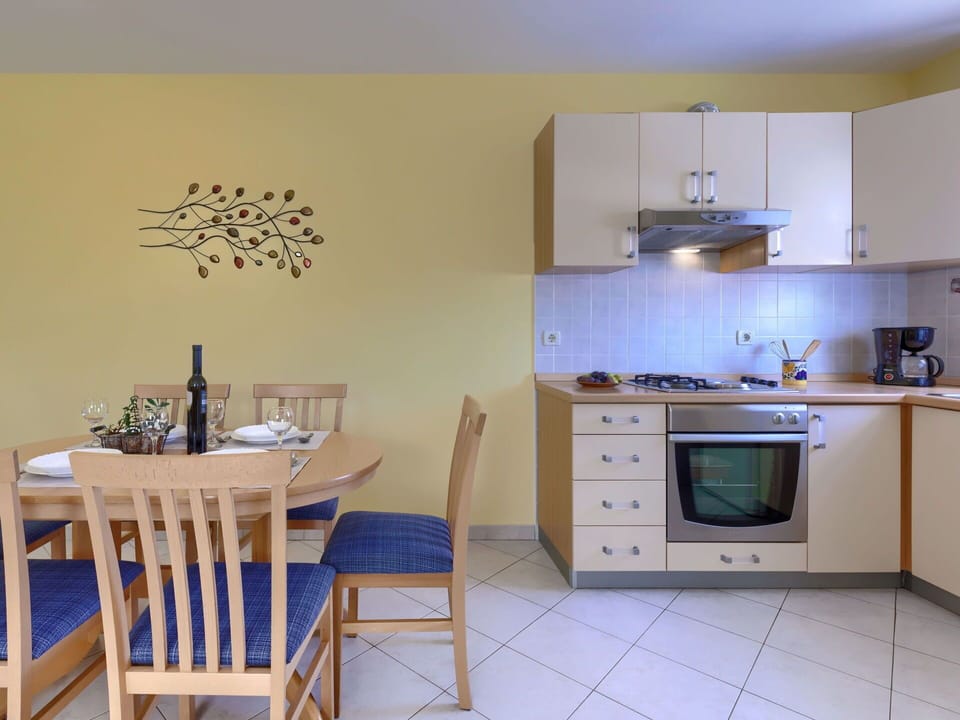 Furniture, Cabinetry, Property, Countertop, Kitchen Stove, Kitchen Appliance, Wood, Lighting, Interior Design, Drawer