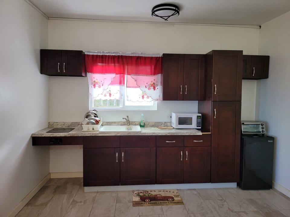 Fully stocked kitchen includes an array of cookware, utensils and equipment.