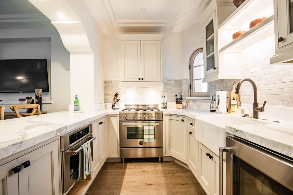 All calcutta marble kitchen with everything you need for an executive suite!