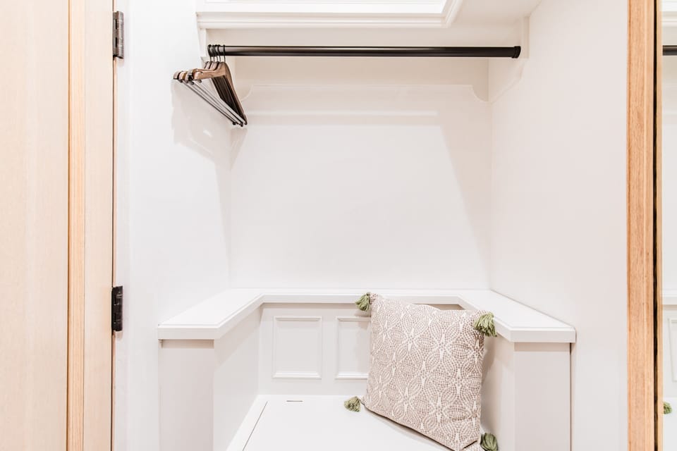 There's even a sweet bench in the closet!