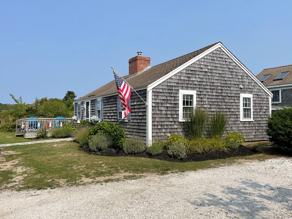 Side View of House with Driveway and Deck