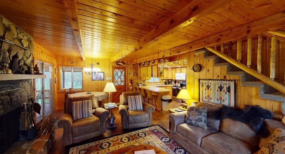 The living room has plenty of seating for everyone to enjoy.