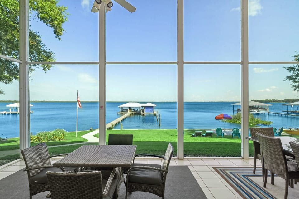 64' x 14' back porch is one of the largest on the lake, 4 separate seating areas