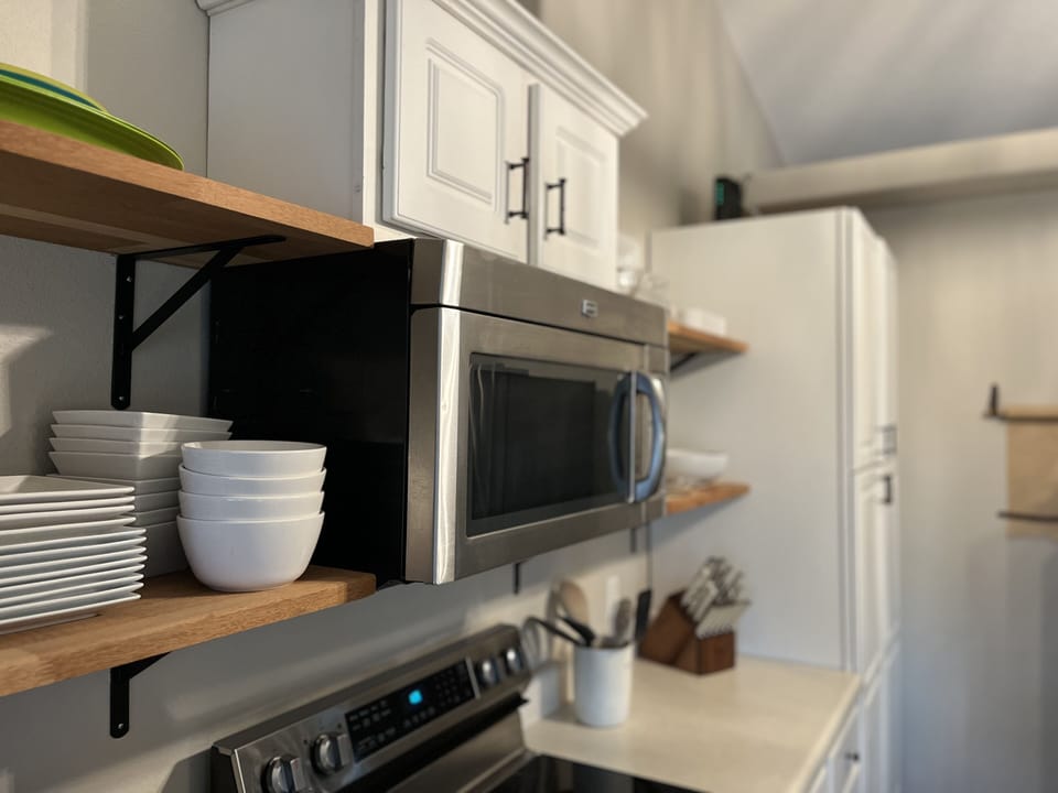 Kitchen with plenty of dinnerware to host a family of 10