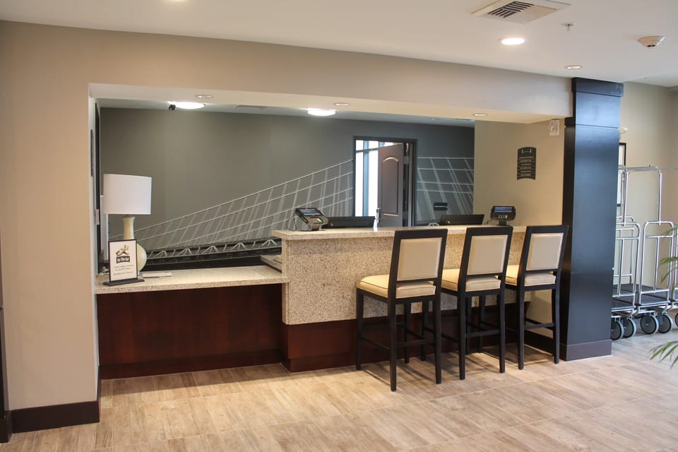 Front desk lobby area with seating and warm lighting.