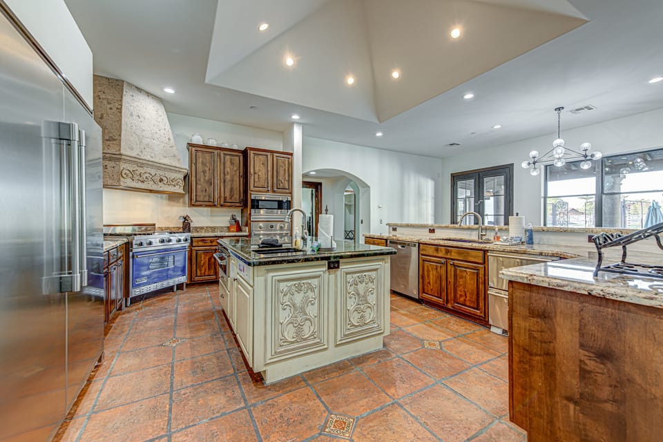 Adorned with luxurious finishes, high-end appliances, and refined cabinetry.