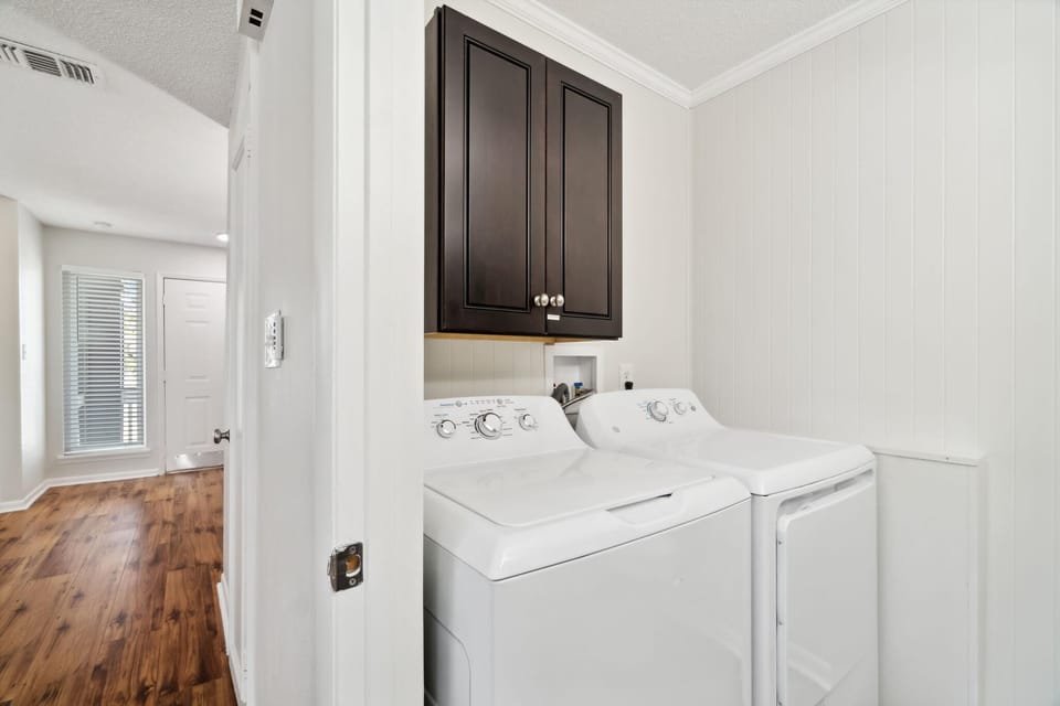 Main Floor Toilet Room with Single Vanity and Washer/Dryer