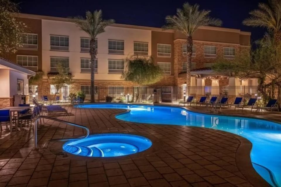 Unwind in the heated outdoor pool and hot tub with cozy lights.