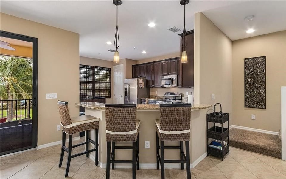 Counter seating in kitchen/dining area provides 3 extra seats