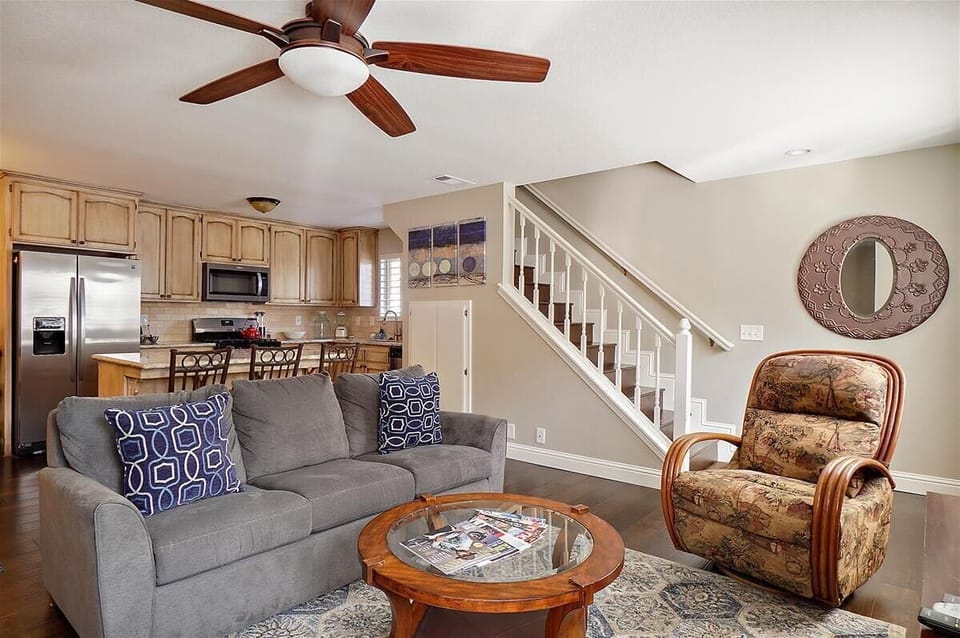 Downstairs Living area, stairs and kitchen behind