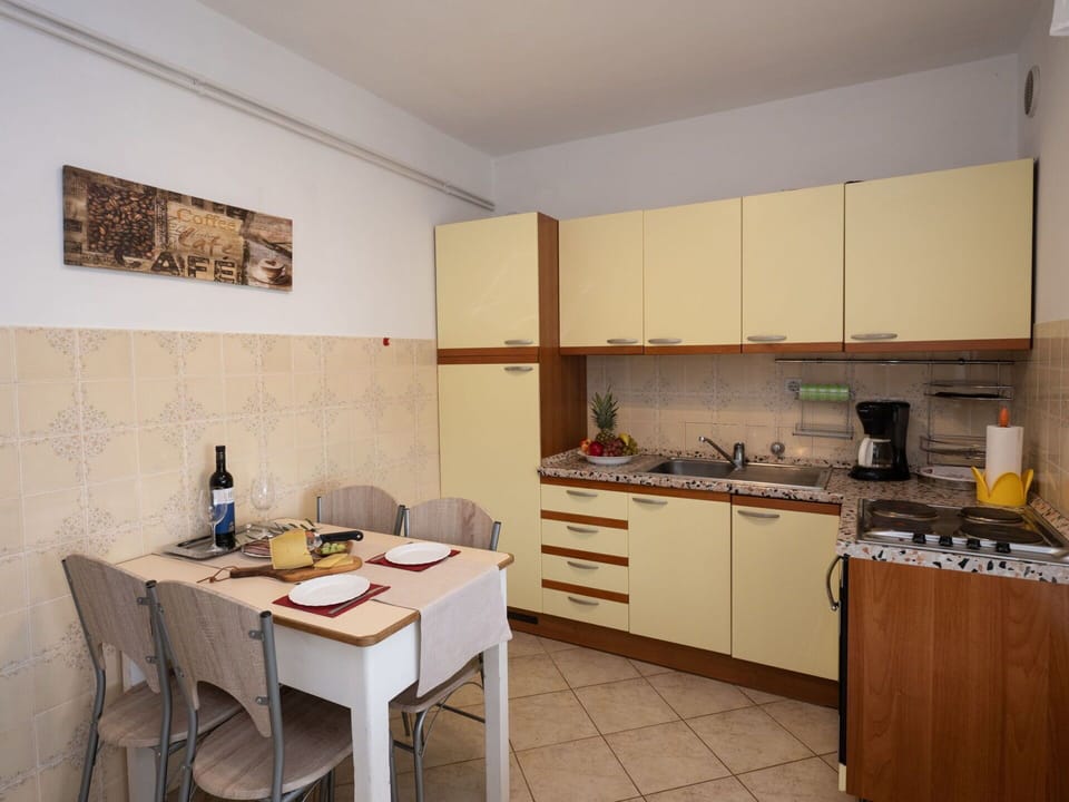 Cabinetry, Furniture, Property, Building, Sink, Table, Countertop, Kitchen Stove, Chair, Wood
