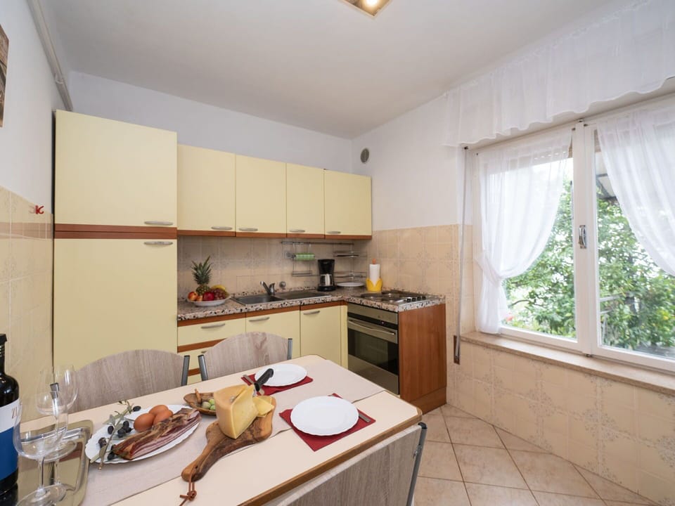 Cabinetry, Property, Countertop, Window, Food, Table, Wood, Interior Design, Sink, Kitchen Appliance