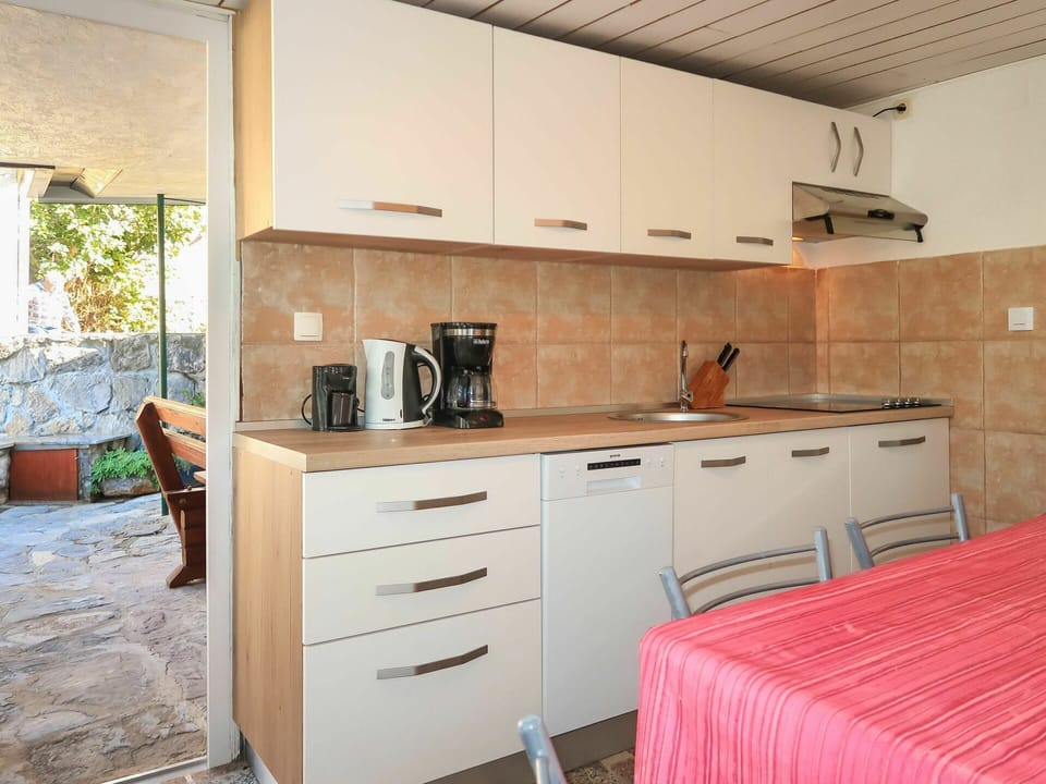 Cabinetry, Furniture, Building, Property, Countertop, Wood, Drawer, Interior Design, Architecture, Plant