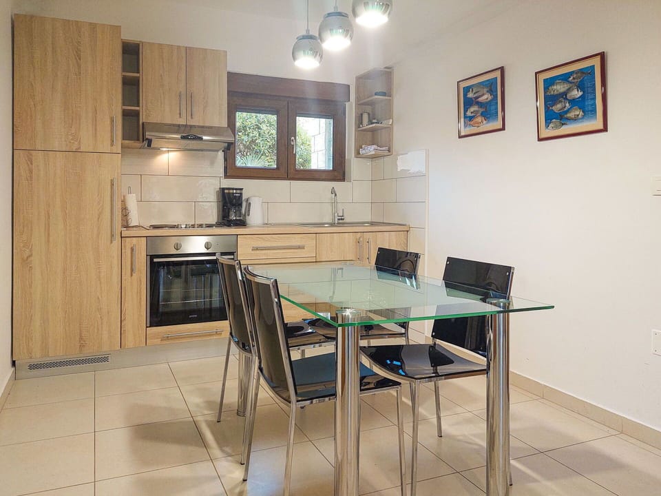 Furniture, Interior Design, Flooring, Wood, Floor, Kitchen, Kitchen Appliance, Chair, Major Appliance, Room