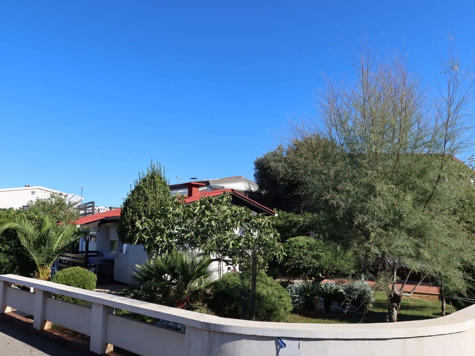 Sky, Plant, Tree, Urban Design, Slope, Landscape, Shade, Road, Shrub, Leisure