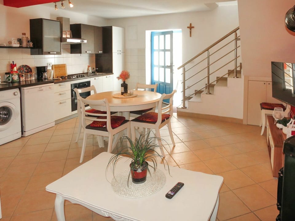 Table, Furniture, Property, Cabinetry, Countertop, Kitchen Appliance, Houseplant, Lighting, Desk, Kitchen Stove