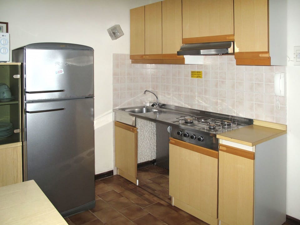 Property, Cabinetry, Room, Kitchen, Countertop, Major Appliance, Kitchen Stove, Furniture, Refrigerator, Interior Design