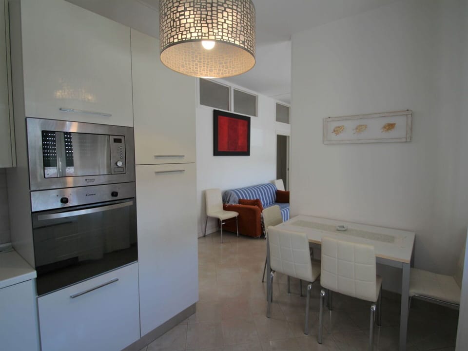 Furniture, Table, Chair, Cabinetry, Lighting, Wood, Kitchen Appliance, Interior Design, Refrigerator, Building