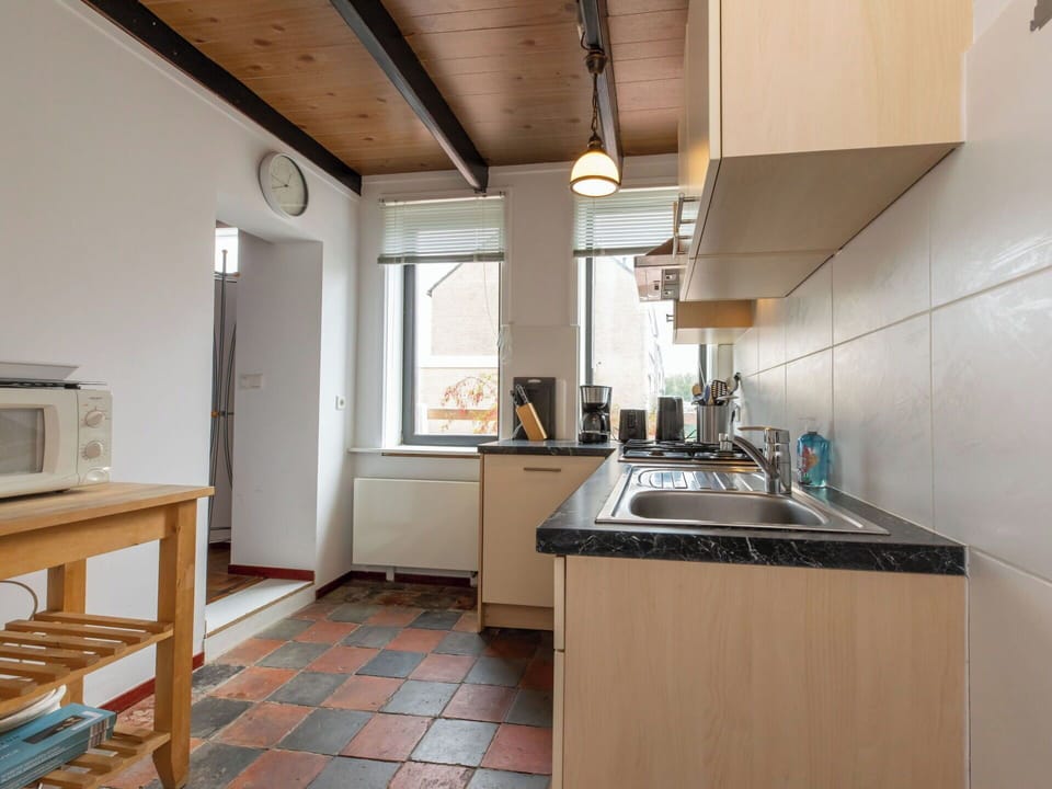 Kitchen, Flooring, Kitchen Appliance, Wood, Countertop, Interior Design, Major Appliance, Ceiling, Floor, Cabinetry