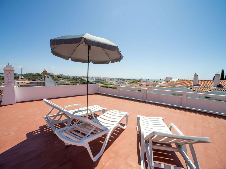 Sky, Furniture, Table, Building, Umbrella, Outdoor Furniture, Shade, Wood, Chair, Sunlounger