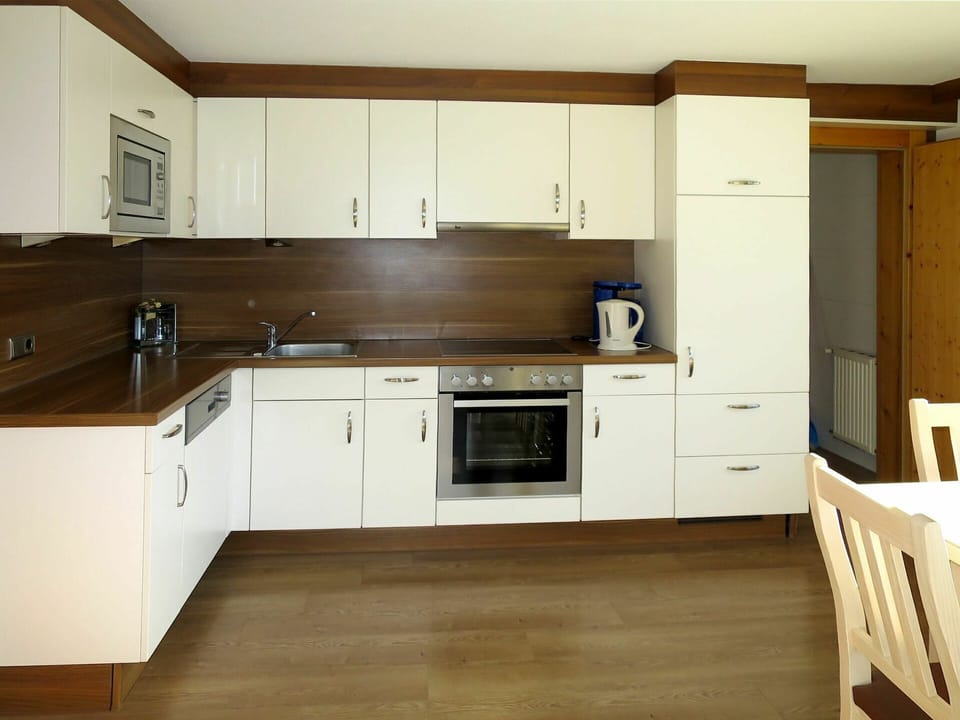 Countertop, Room, Cabinetry, Furniture, Kitchen, Property, Floor, Hardwood, Major Appliance, Interior Design