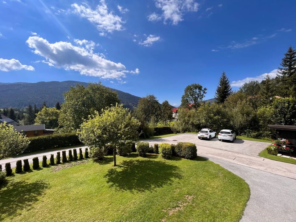 Cloud, Sky, Plant, Tree, Mountain, Natural Landscape, Highland, Land Lot, Grass, Asphalt