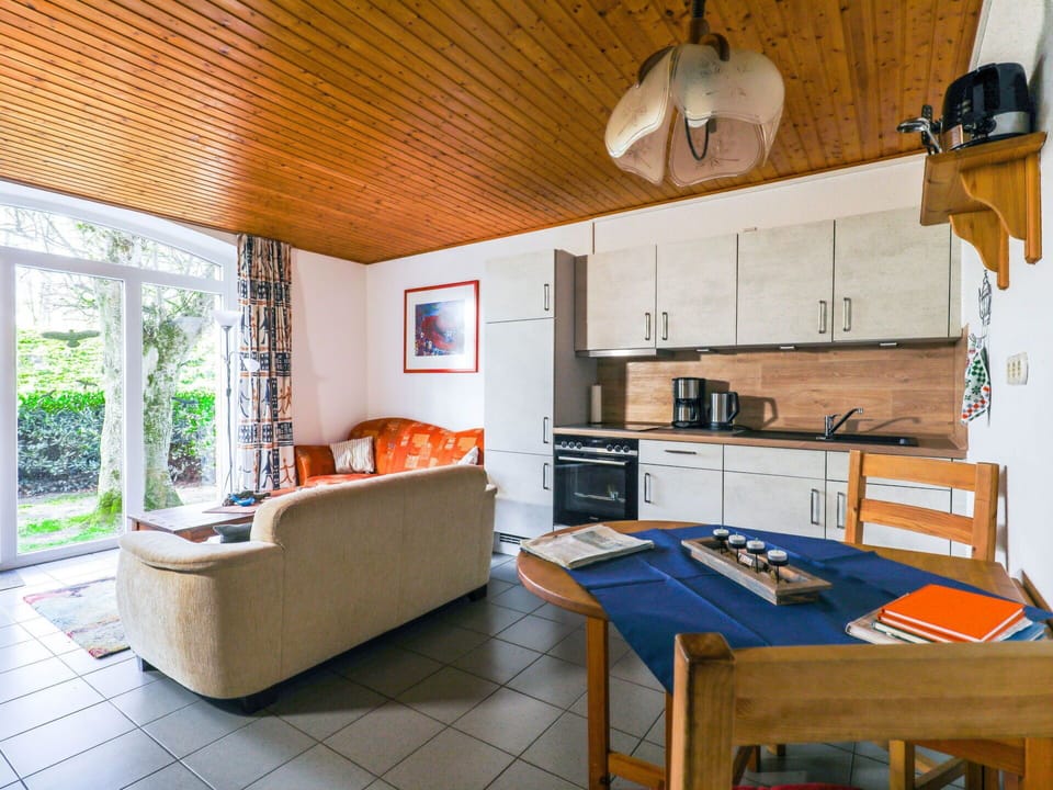 Furniture, Property, Table, Lighting, Interior Design, Wood, Plant, Picture Frame, Cabinetry, Flooring