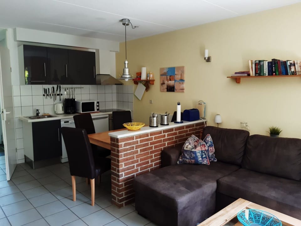 Property, Cabinetry, Furniture, Table, Couch, Countertop, Lighting, Interior Design, Living Room, Home Appliance