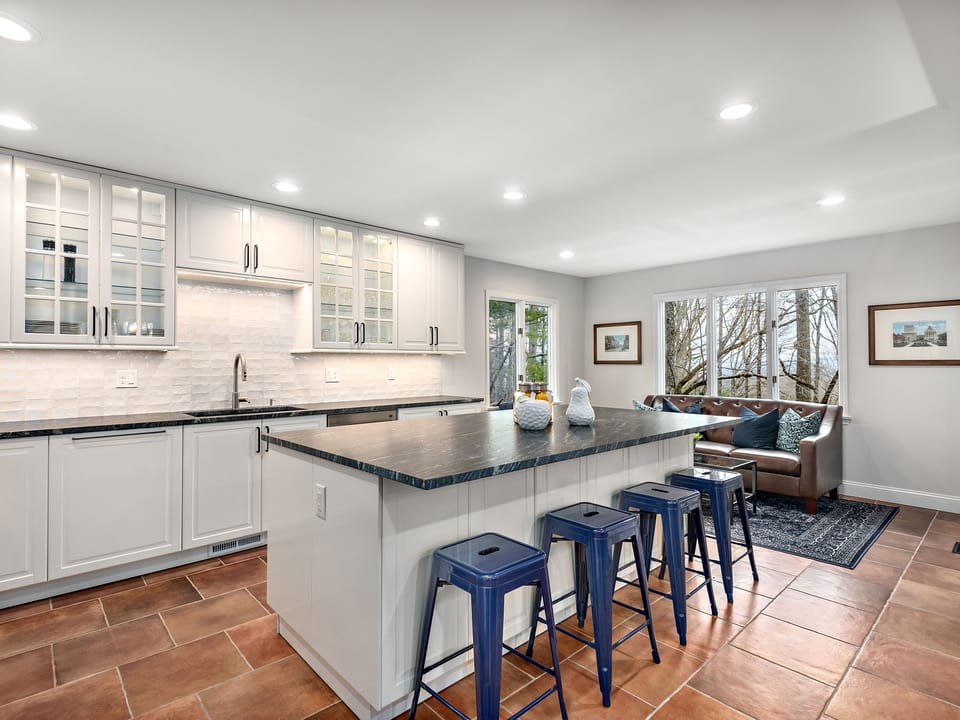 Moroccan inspired ceramic backsplash mixes old world with contemporary design.  