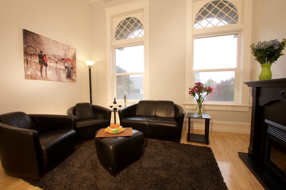 Comfortable living room with fireplace and view of Main Street.