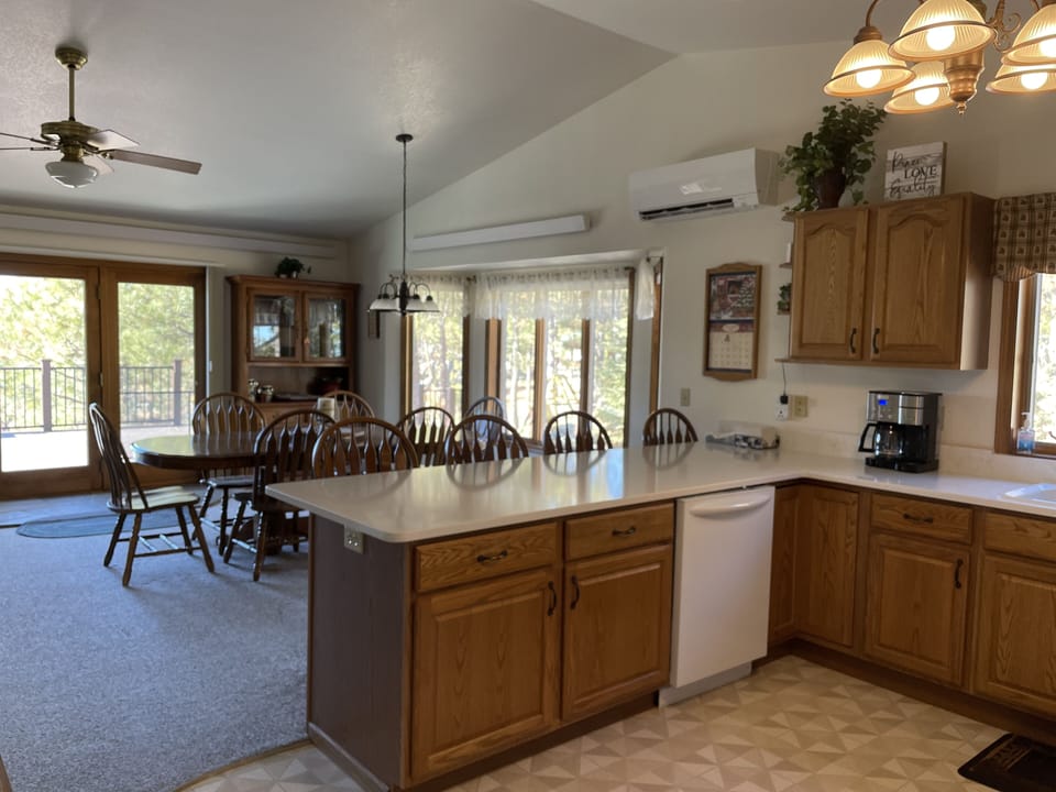 Kitchen with coffee maker,  both drip pot and individual cups and dishwasher.