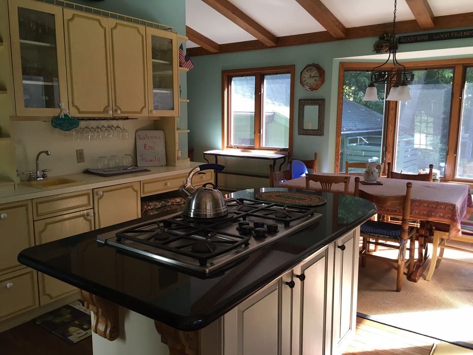 Spacious eat-in kitchen . Table expands