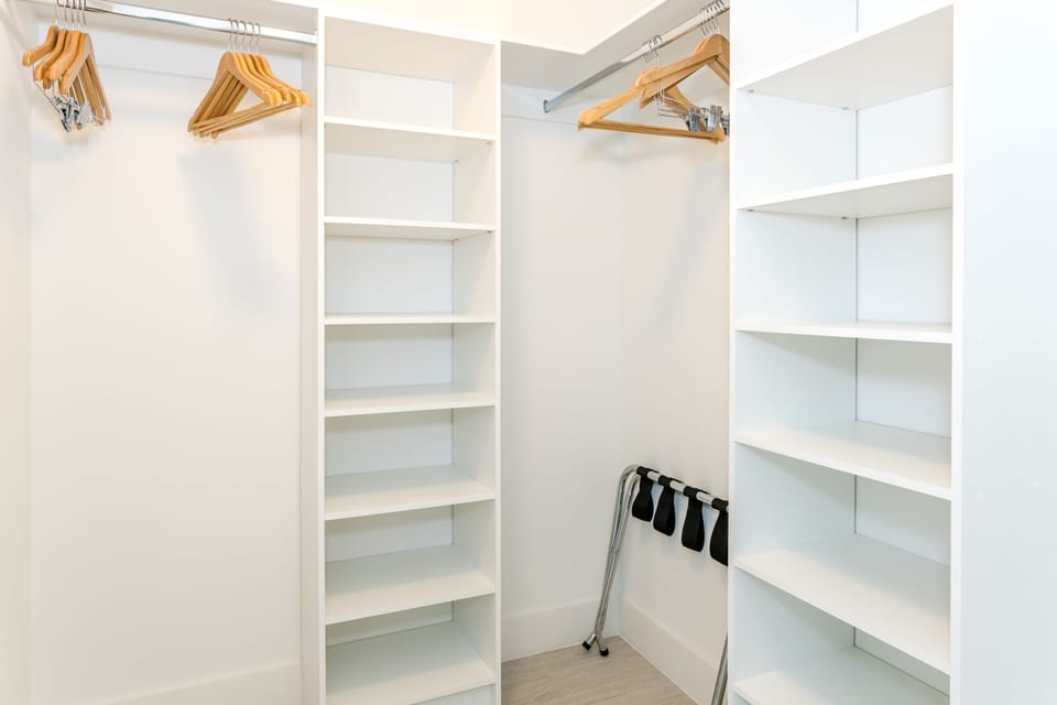 Walk-in closet with hangers.