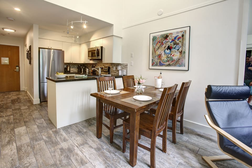 Looking into the kitchen from the dining area. The table expands to sit 6 people